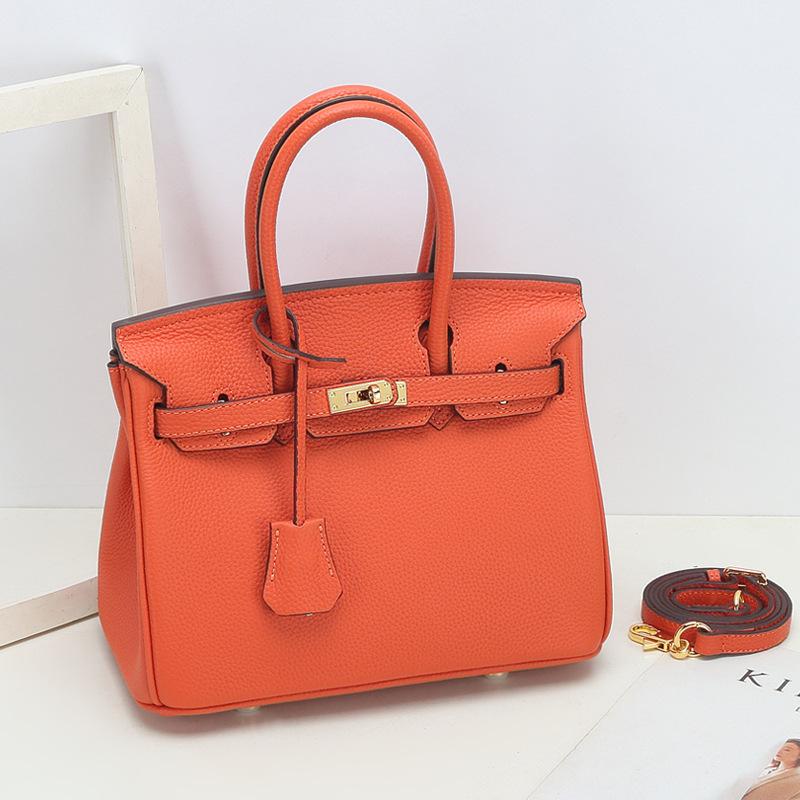Togo Small Grain Top Layer Rindsleder Platin Tasche Damen Echtleder Modische Einzel-Schulter-Handtasche Textur Tasche 25x14x19cm orange von Joom DACH