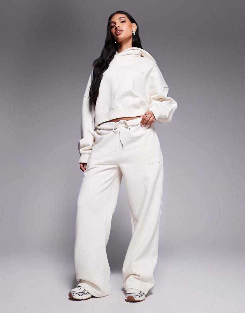 Kaiia - Cropped-Oversize-Kapuzenpullover mit hohem Baumwollanteil in milchigem Hellbeige mit Bubble-Logoprägung, Kombiteil-Lila von Kaiia