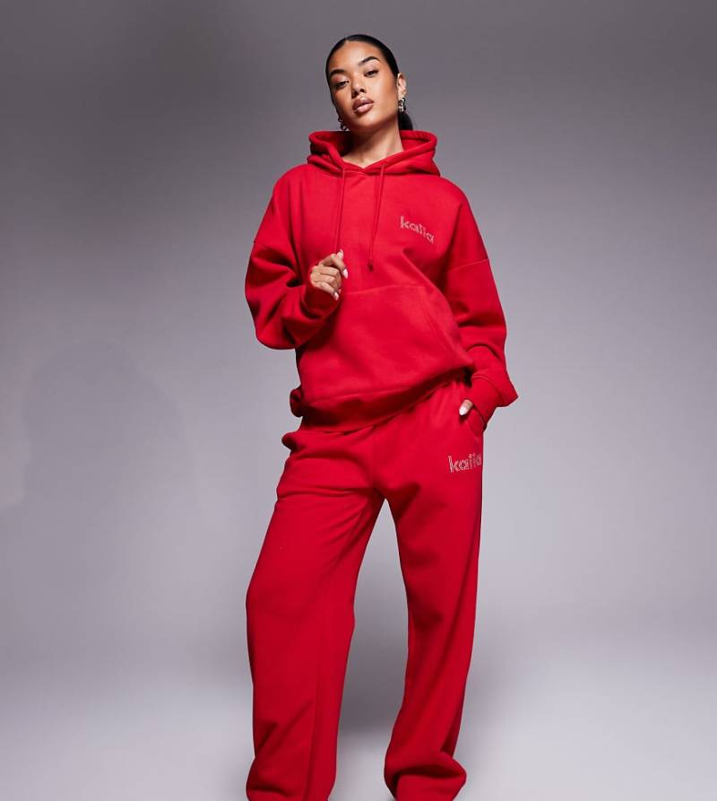 Kaiia - Exclusive - Jogginghose mit hohem Baumwollanteil in Rot, weitem Bein und strassbesetztem Logo, Kombiteil von Kaiia