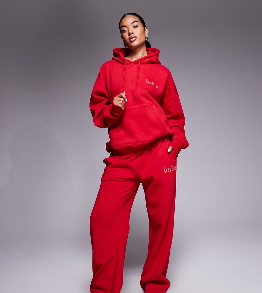 Kaiia - Exclusive - Jogginghose mit hohem Baumwollanteil in Rot, weitem Bein und strassbesetztem Logo, Kombiteil von Kaiia