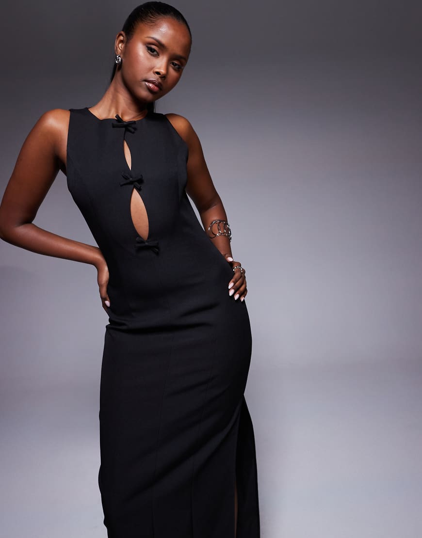 Kaiia - Exclusive - Maxikleid in Schwarz mit Zierausschnitt, Seitenschlitz und Schleifendetail Kaiia - Exclusive - Maxikleid in Schwarz mit Zierausschnitt, Seitenschlitz und Schleifendetail von Kaiia
