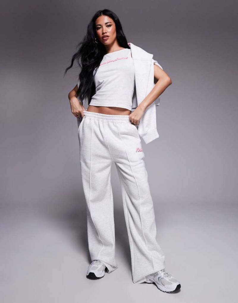 Kaiia - Jogginghose aus Baumwollmix in meliertem Hellgrau mit weitem Bein, Schaumdruck-Logo in Rosa und Ziernähten, Kombiteil von Kaiia