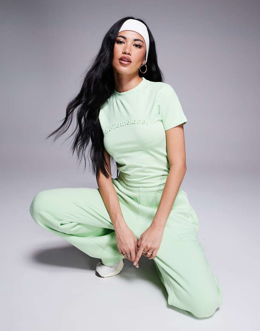 Kaiia - Knappes T-Shirt in Sherbet-Limettengrün mit Logoprägung, Kombiteil Kaiia - Knappes T-Shirt in Sherbet-Limettengrün mit Logoprägung, Kombiteil von Kaiia