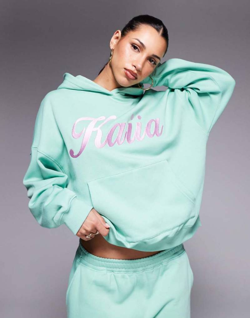 Kaiia - Oversize-Kapuzenpullover in Grün und Rosa mit gesticktem Wirbel-Logo, Kombiteil von Kaiia
