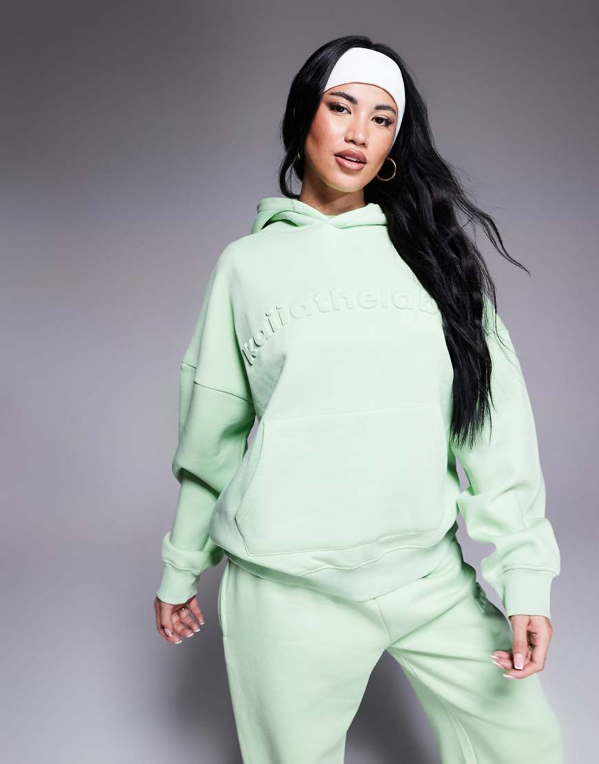 Kaiia - Oversize-Kapuzenpullover in Sherbet-Limettengrün mit Logoprägung, Kombiteil Kaiia - Oversize-Kapuzenpullover in Sherbet-Limettengrün mit Logoprägung, Kombiteil von Kaiia