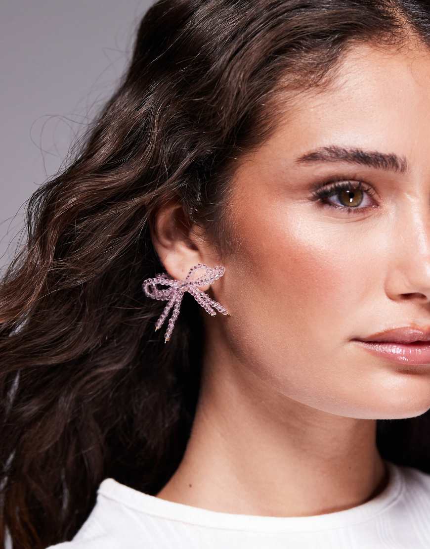 Kaiia - Exklusive, perlenbesetzte Schleifen-Ohrringe in Rosa mit zweireihigem Design Kaiia - Exklusive, perlenbesetzte Schleifen-Ohrringe in Rosa mit zweireihigem Design von Kaiia