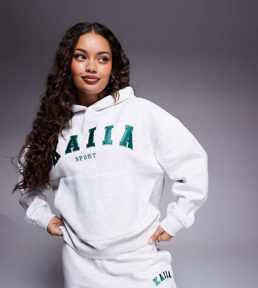 Kaiia Sport Petite - Kapuzenpullover in grau meliert mit Logo-Stickerei, Kombiteil Kaiia Sport Petite - Kapuzenpullover in grau meliert mit Logo-Stickerei, Kombiteil von Kaiia