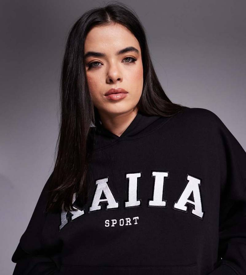 Kaiia Sport Plus - Oversize-Kapuzenpullover in Schwarz mit Logo-Stickerei, Kombiteil von Kaiia