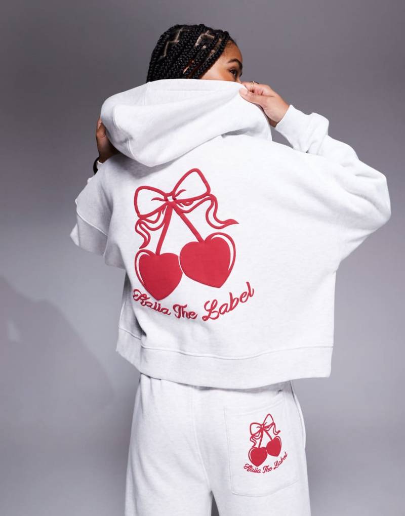 Kaiia Studio - Cropped-Kapuzenjacke mit hohem Baumwollanteil in Grau meliert mit rotem Kirschprint auf dem Rücken, Kombiteil von Kaiia