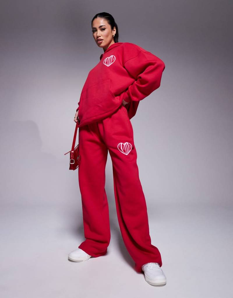 Kaiia - Weit geschnittene Jogginghose aus Baumwollmix in Rot und Rosa mit farblich abgesetztem Herz-Logo und breitem Bund, Kombiteil von Kaiia