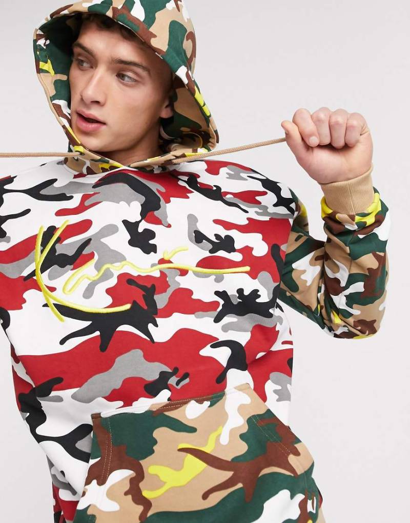 Karl Kani - Signature - Kapuzenpullover mit Military-Muster in Rot Karl Kani - Signature - Kapuzenpullover mit Military-Muster in Rot von Karl Kani