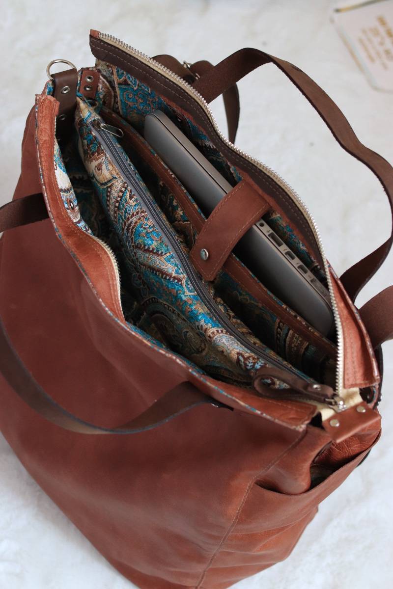 Zusätzliche Taschen Laptoptasche, Seitliche Wassertasche, Schiebe - Und Reißverschlusstaschen von Khelmanbags