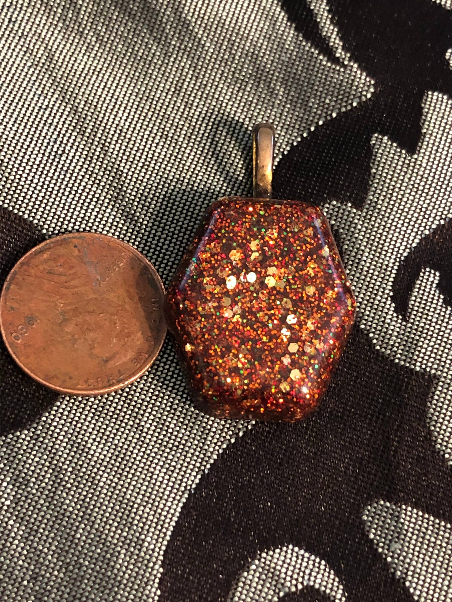 Schöner Kleiner Orangefarbener Glitzer-Anhänger Schöner Kleiner Orangefarbener Glitzer-Anhänger von KrystalGifts