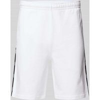 Lacoste Regular Fit Sweatshorts mit Galonstreifen in Weiss, Größe XL Lacoste Regular Fit Sweatshorts mit Galonstreifen in Weiss, Größe XL von Lacoste