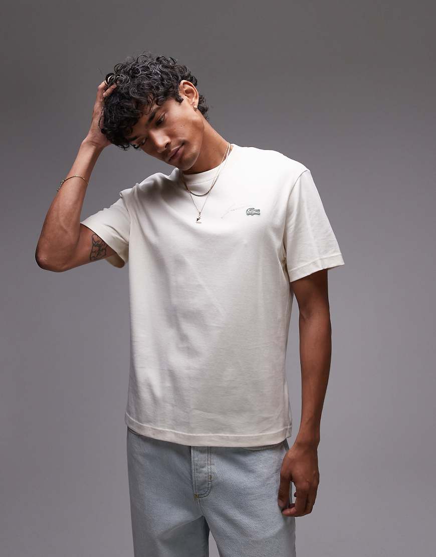Lacoste - T-Shirt in Creme mit Schriftzug-Logo-Weiß von Lacoste