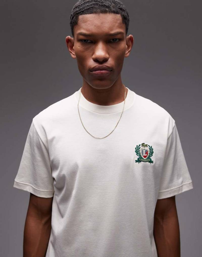 Lacoste - T-Shirt in Wollweiß mit Emblem-Stickerei von Lacoste