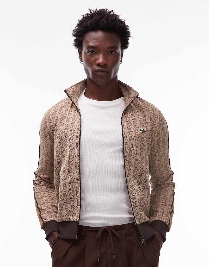 Lacoste - Trainingsjacke in Beige mit Monogramm-Muster und durchgehendem Reißverschluss-Neutral Lacoste - Trainingsjacke in Beige mit Monogramm-Muster und durchgehendem Reißverschluss-Neutral von Lacoste
