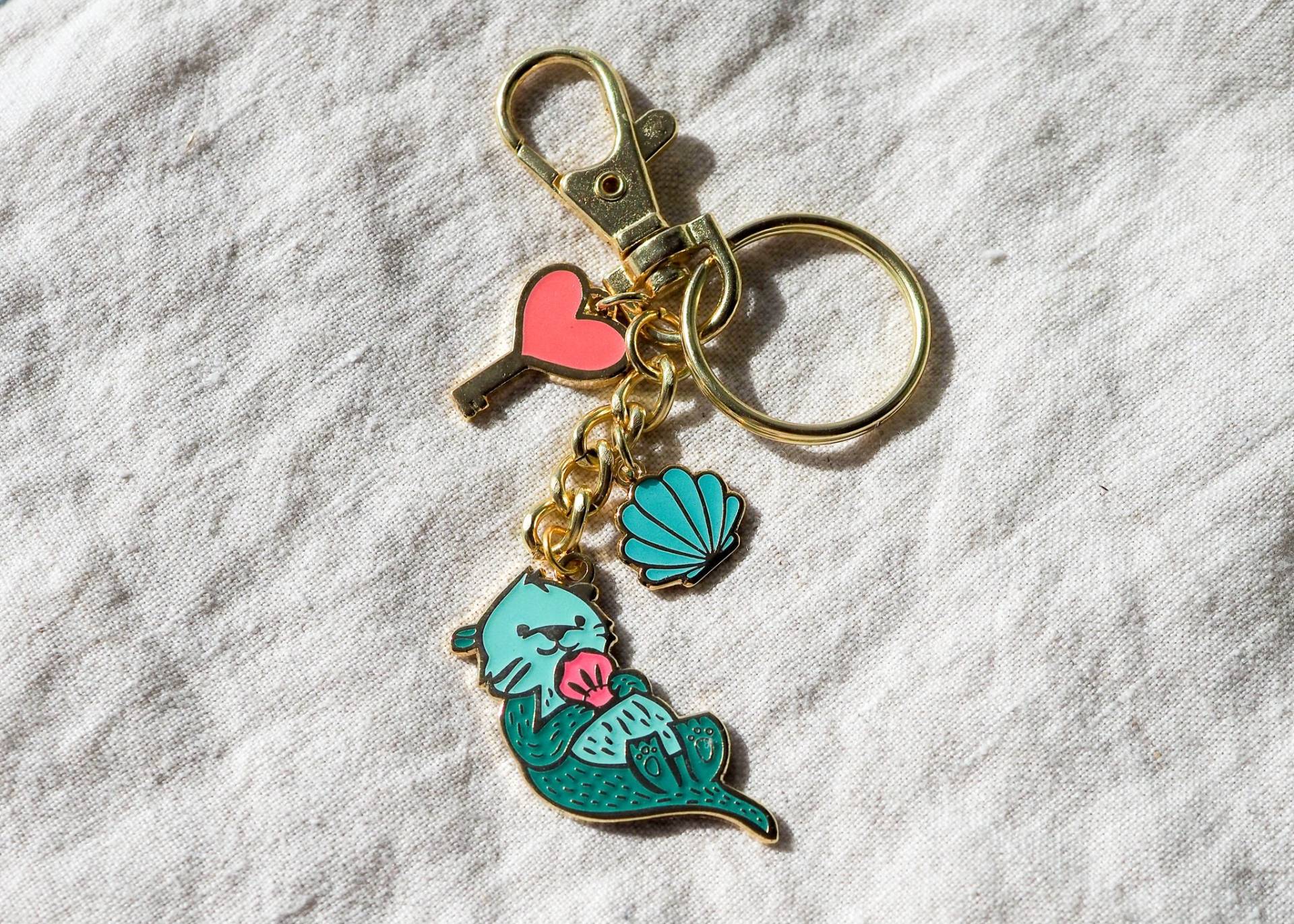 Aqua Sea Otter Schlüsselanhänger | Im Dunkeln Leuchtend Gold Taschenanhänger Aqua Sea Otter Schlüsselanhänger | Im Dunkeln Leuchtend Gold Taschenanhänger von LanaBetty