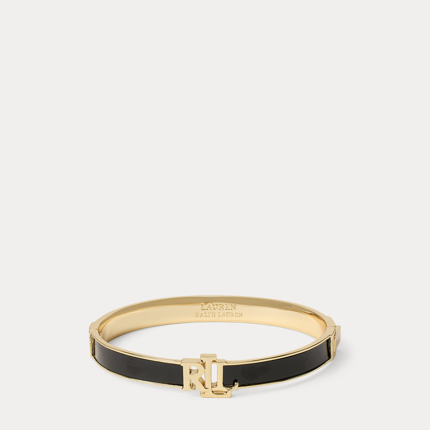 Vergoldeter Scharnierarmreif mit Logo von Lauren