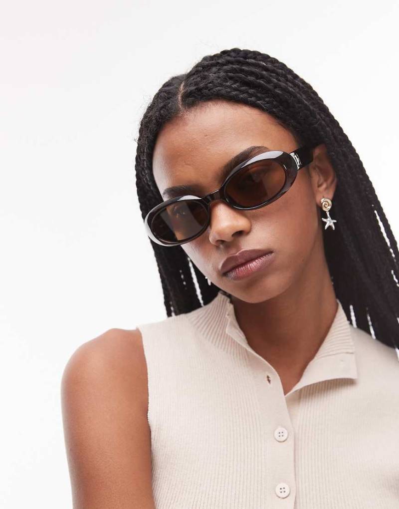 Le Specs - Work It - Ovale Sonnenbrille mit polarisierten Gläsern in Schokobraun von Le Specs