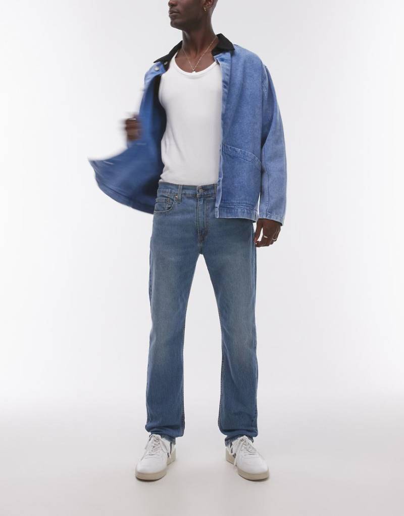 Levi's - 502 - Performance Cool - Schmal zulaufende Denim-Jeans in Mittelblau Levi's - 502 - Performance Cool - Schmal zulaufende Denim-Jeans in Mittelblau von Levi's