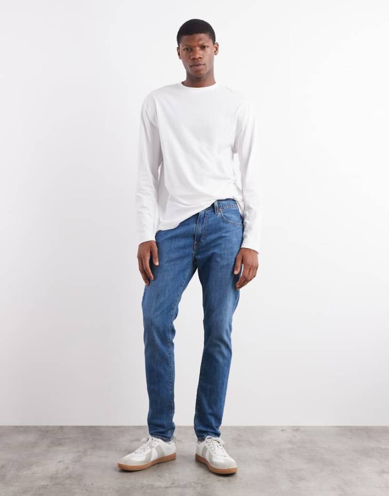 Levi's - 512 - Schmal zulaufende Jeans in mittelblauer Waschung mit schmalem Schnitt von Levi's