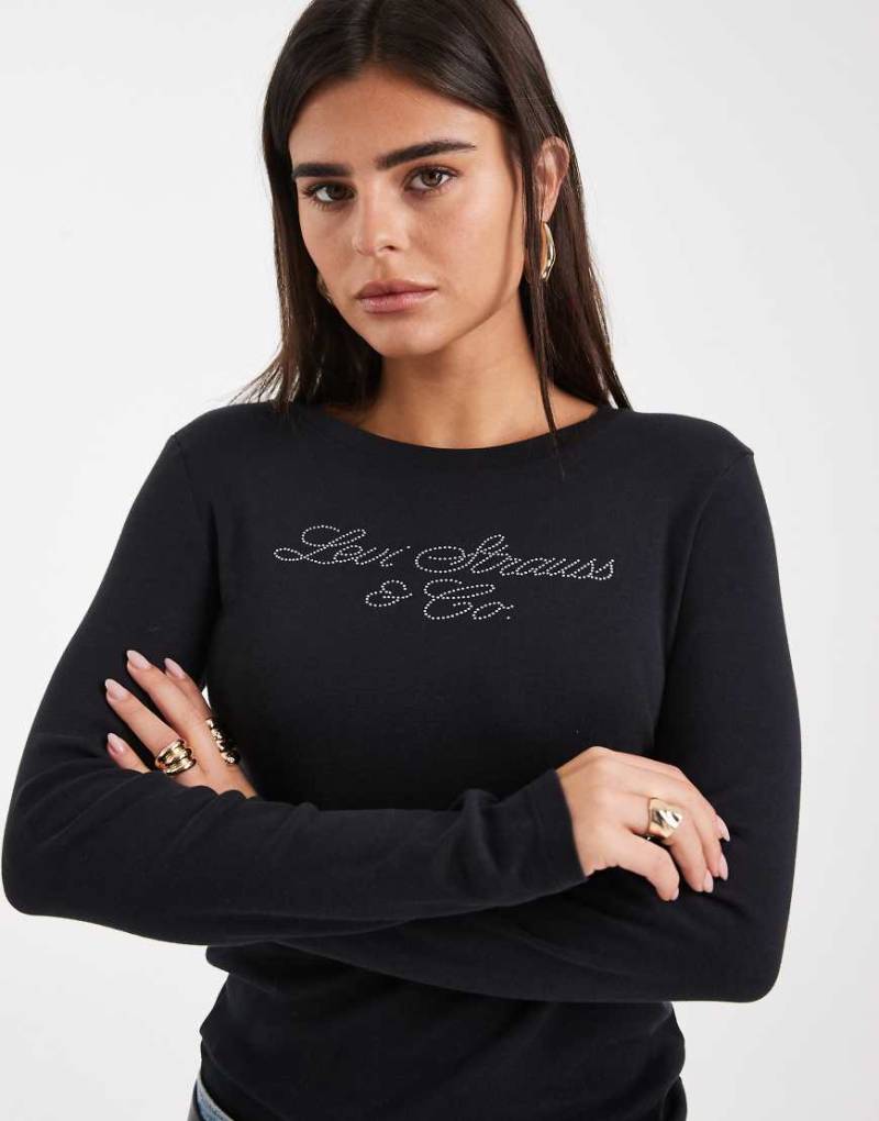 Levi's - Langärmliges Basic-T-Shirt in Schwarz mit Glitzerlogo Levi's - Langärmliges Basic-T-Shirt in Schwarz mit Glitzerlogo von Levi's