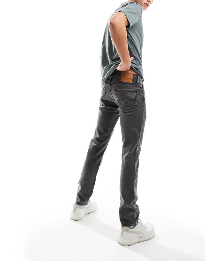 Levis 511 - Schmal geschnittene Jeans in verwaschenem Schwarz von Levi's