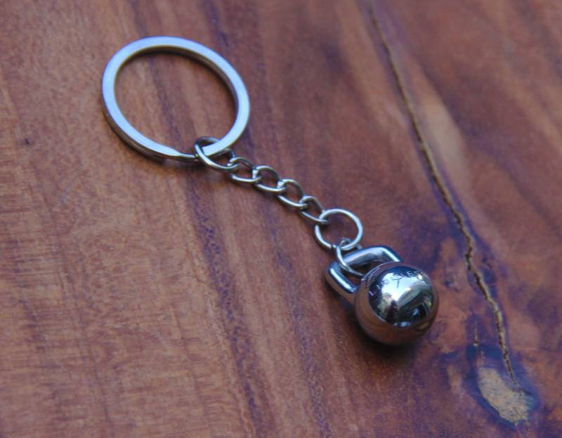 Edelstahl Kettlebell Keychain Silber/Gold Oberflächen Edelstahl Kettlebell Keychain Silber/Gold Oberflächen von LimitlessAesthetics