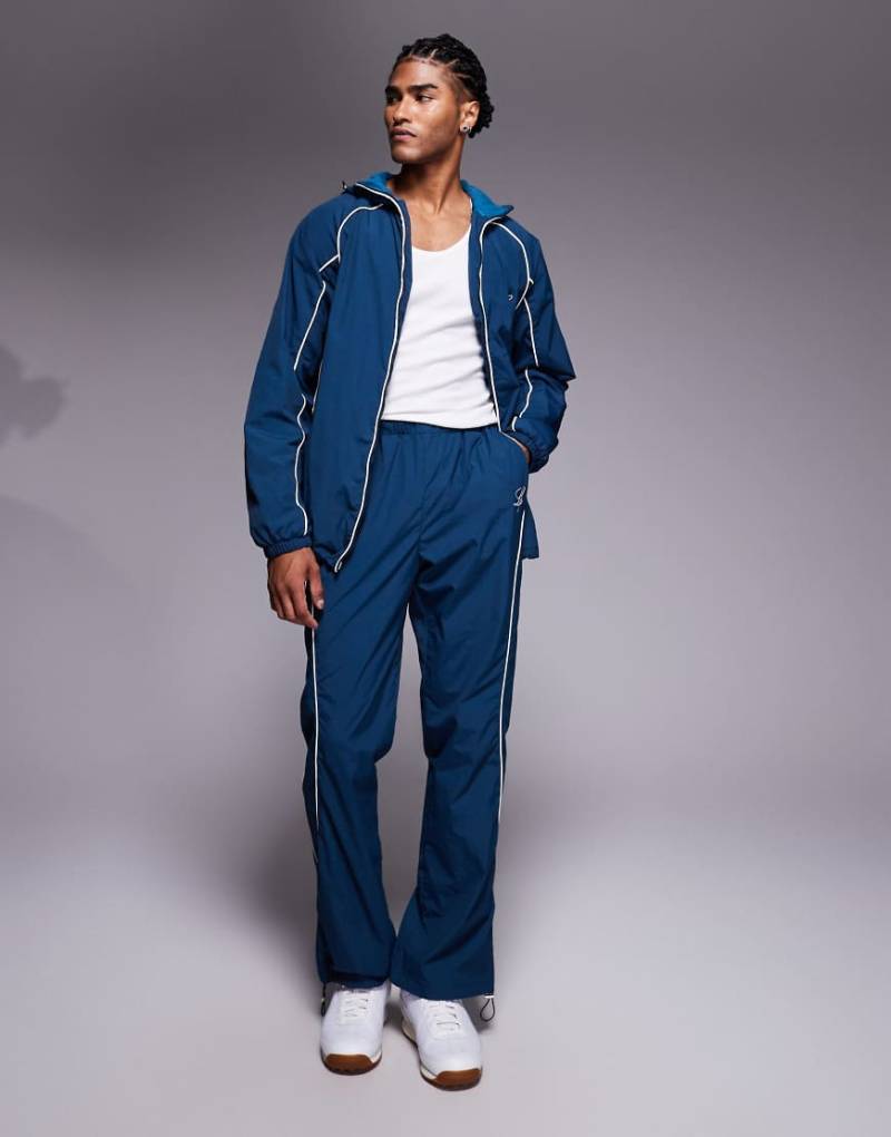 Liquor N Poker - Relaxed-Fit-Jogginghose aus Nylon in Marineblau mit Logo und Paspelierung, Kombiteil von Liquor N Poker