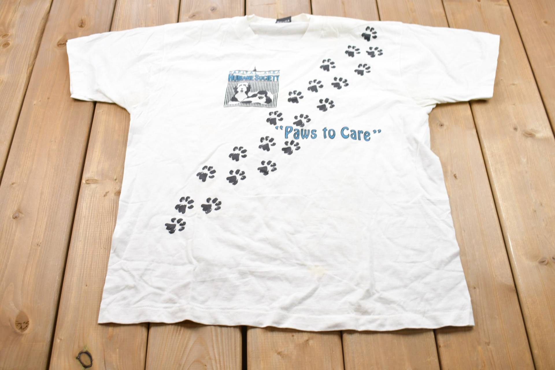 Vintage 1990S Paws To Care Humane Society Grafik T-Shirt/80Er 90Er Jahre Streetwear Retro Style Einzelstich Made in Usa von Lostboysvintage