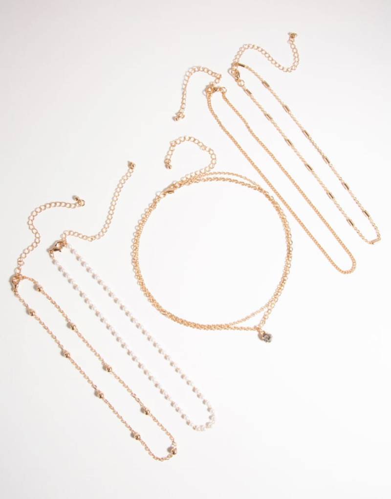 Lovisa - 6er-Pack Choker-Ketten in Goldoptik mit Strass- und Perlendetails-Goldfarben Lovisa - 6er-Pack Choker-Ketten in Goldoptik mit Strass- und Perlendetails-Goldfarben von Lovisa
