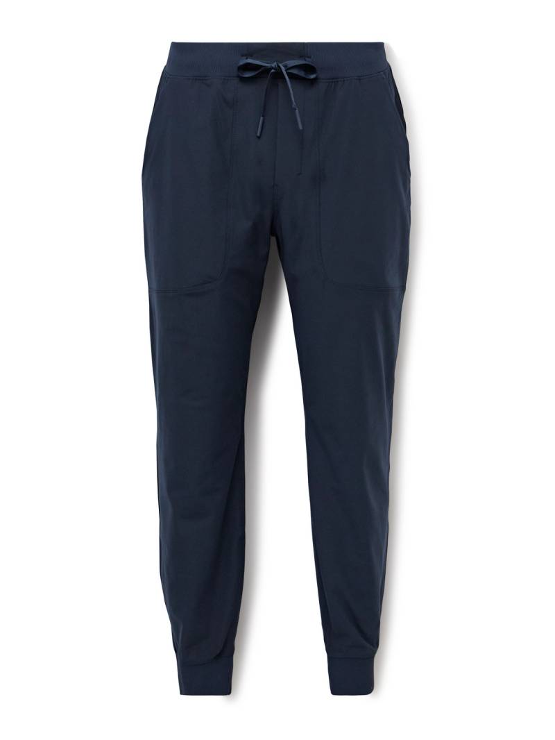 Lululemon - ABC Tapered Warpstreme™ Drawstring Trousers - Men - Blue - L von Lululemon