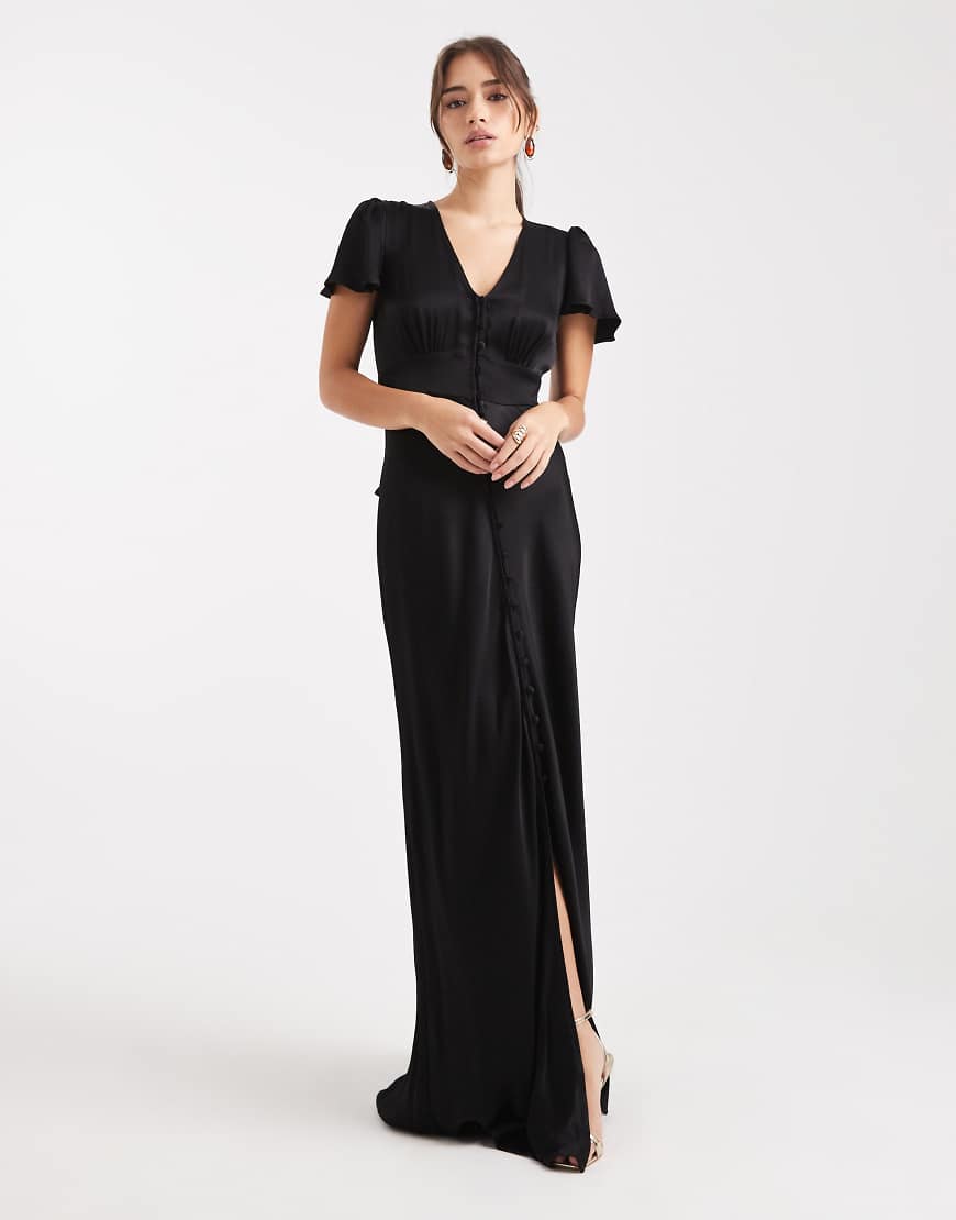 Maids to Measure - Bridesmaid - Maxikleid in Schwarz mit Knopfleiste auf der Vorderseite und Kappärmeln Maids to Measure - Bridesmaid - Maxikleid in Schwarz mit Knopfleiste auf der Vorderseite und Kappärmeln von Maids to Measure
