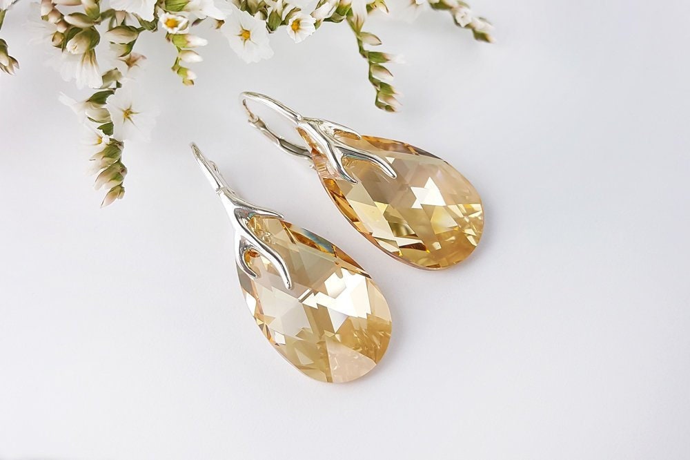 Swarovski Ohrringe, Golden Shadow, Teardrop, Gold Crystal, Sterlingsilber, Elements, Drop Amber Champagne Ohrringe Swarovski Ohrringe, Golden Shadow, Teardrop, Gold Crystal, Sterlingsilber, Elements, Drop Amber Champagne Ohrringe von MalayaGarnet