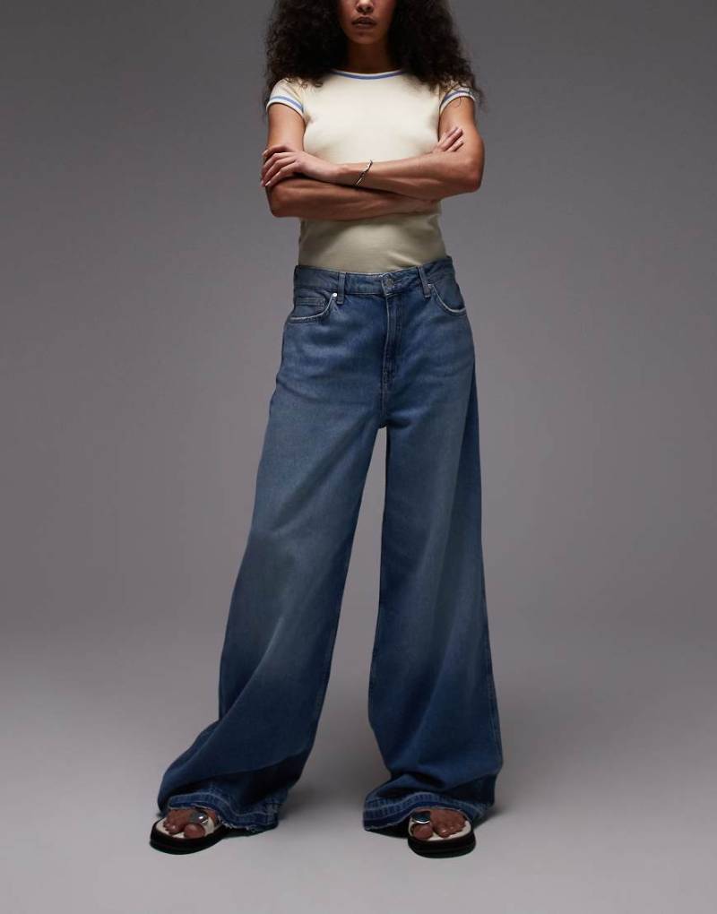 Mango - Aba - Weit geschnittene Jeans in Blau mit abgesetztem Saum von Mango