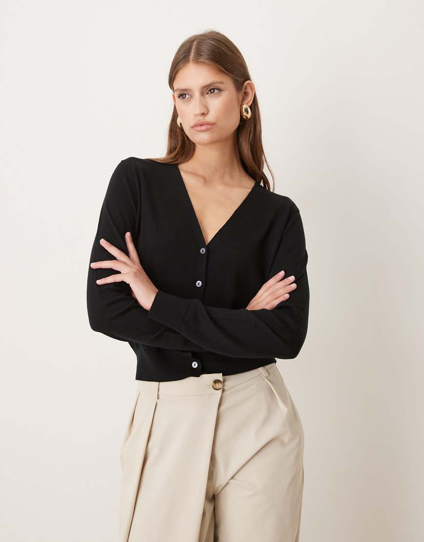 Mango - Capsule - Strukturierte Strickjacke aus 100% Wolle in Schwarz mit V-Ausschnitt von Mango