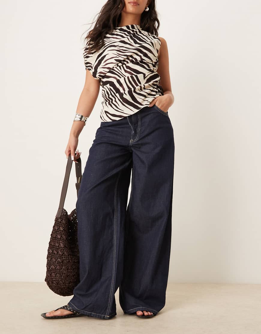 Mango - Dunkelblaue Hose aus Leinenmix in Denim-Optik mit elastischem Bund und weitem Bein Mango - Dunkelblaue Hose aus Leinenmix in Denim-Optik mit elastischem Bund und weitem Bein von Mango