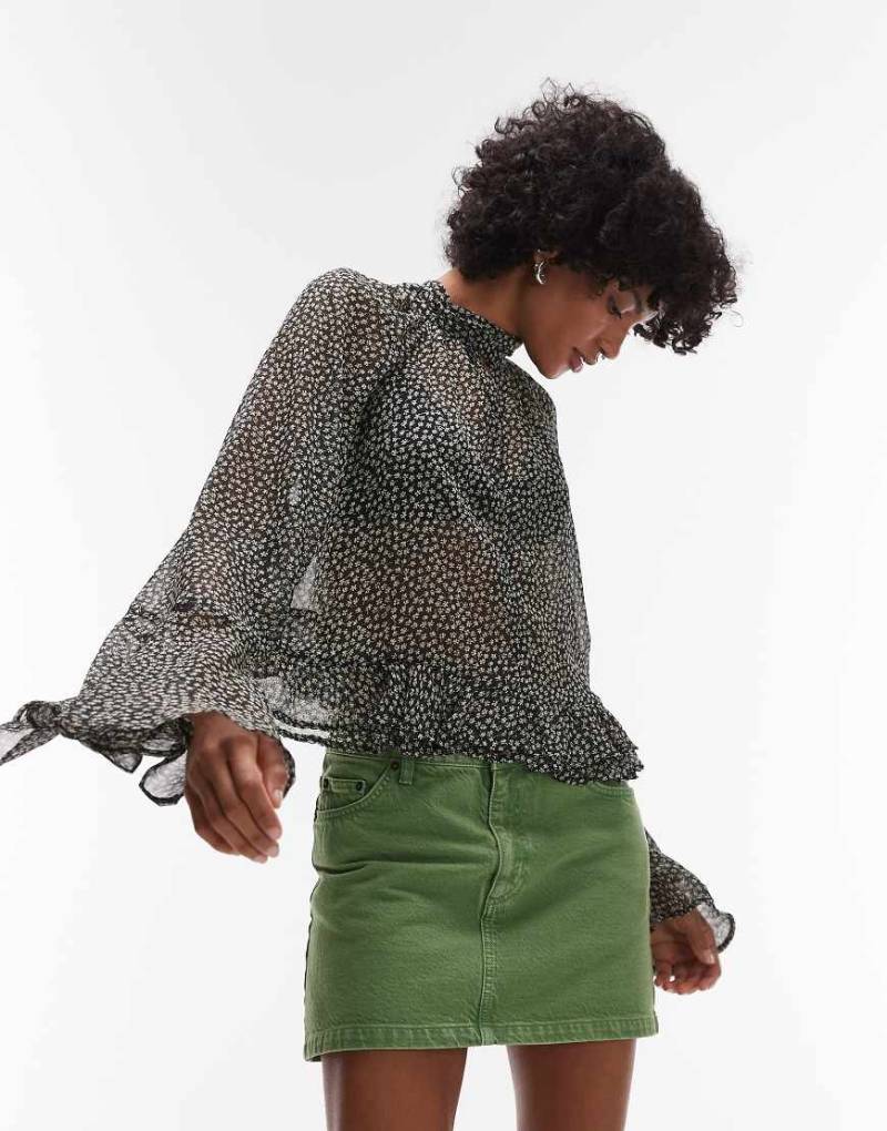 Mango - Gemusterte Bluse in Schwarz mit ausgestellten Ärmeln von Mango