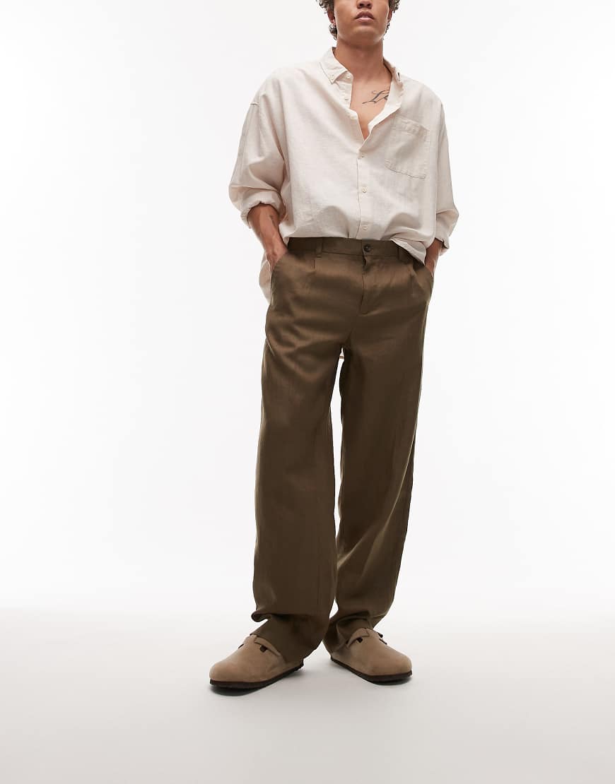 Mango - Hochwertige, schmal zulaufende Hose aus Leinen in Dunkelbraun Mango - Hochwertige, schmal zulaufende Hose aus Leinen in Dunkelbraun von Mango