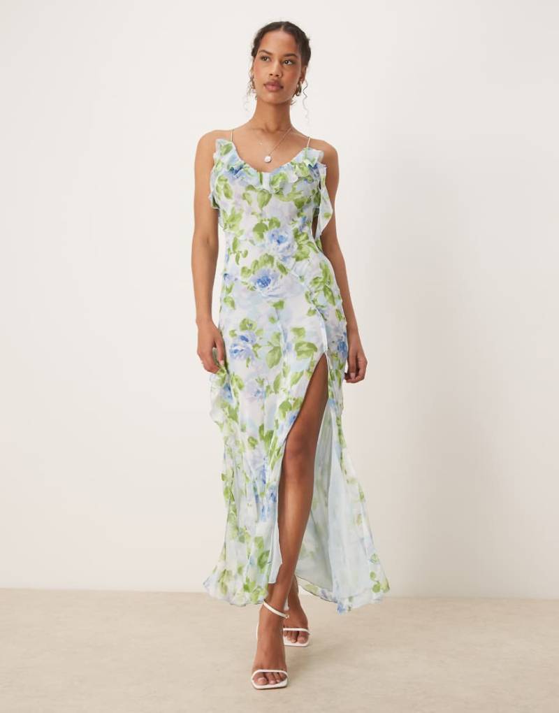 Mango - Kleid in Blassblau mit V-Ausschnitt, Rüschen, Seitenschlitz und botanischem Muster von Mango
