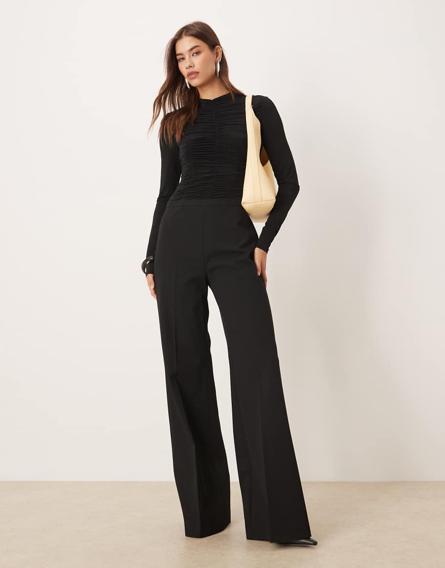 Mango - Langärmliger, strukturierter Jumpsuit in Schwarz Mango - Langärmliger, strukturierter Jumpsuit in Schwarz von Mango