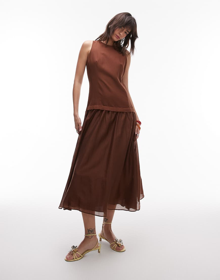 Mango - Leinen-Maxikleid in Schokobraun mit transparentem Saum und tiefer Taille Mango - Leinen-Maxikleid in Schokobraun mit transparentem Saum und tiefer Taille von Mango
