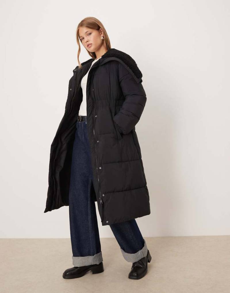 Mango - Pufferjacke in Schwarz mit teilbarem Reißverschluss und Kapuze aus Kunstpelz von Mango