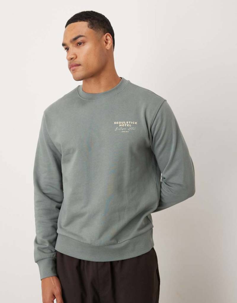 Mango - Sweatshirt aus Baumwolle in Grün mit „Seoul"-Grafikprint von Mango