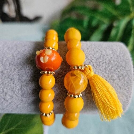 Armbänder Perlen 2Er-Set Orange Mit Quaste Armbänder Perlen 2Er-Set Orange Mit Quaste von MarioMariani