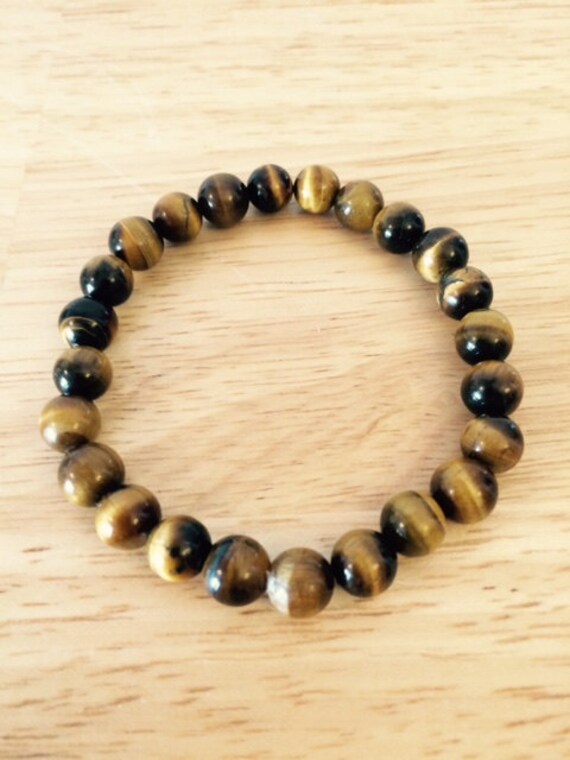 Tigerauge 8mm Spirituelles Armband Handarbeit Maßanfertigung Größen 7 - 8 Zoll Verfügbar Auf Stretch Kordel Unisex Tigerauge 8mm Spirituelles Armband Handarbeit Maßanfertigung Größen 7 - 8 Zoll Verfügbar Auf Stretch Kordel Unisex von MijoMadreDesign
