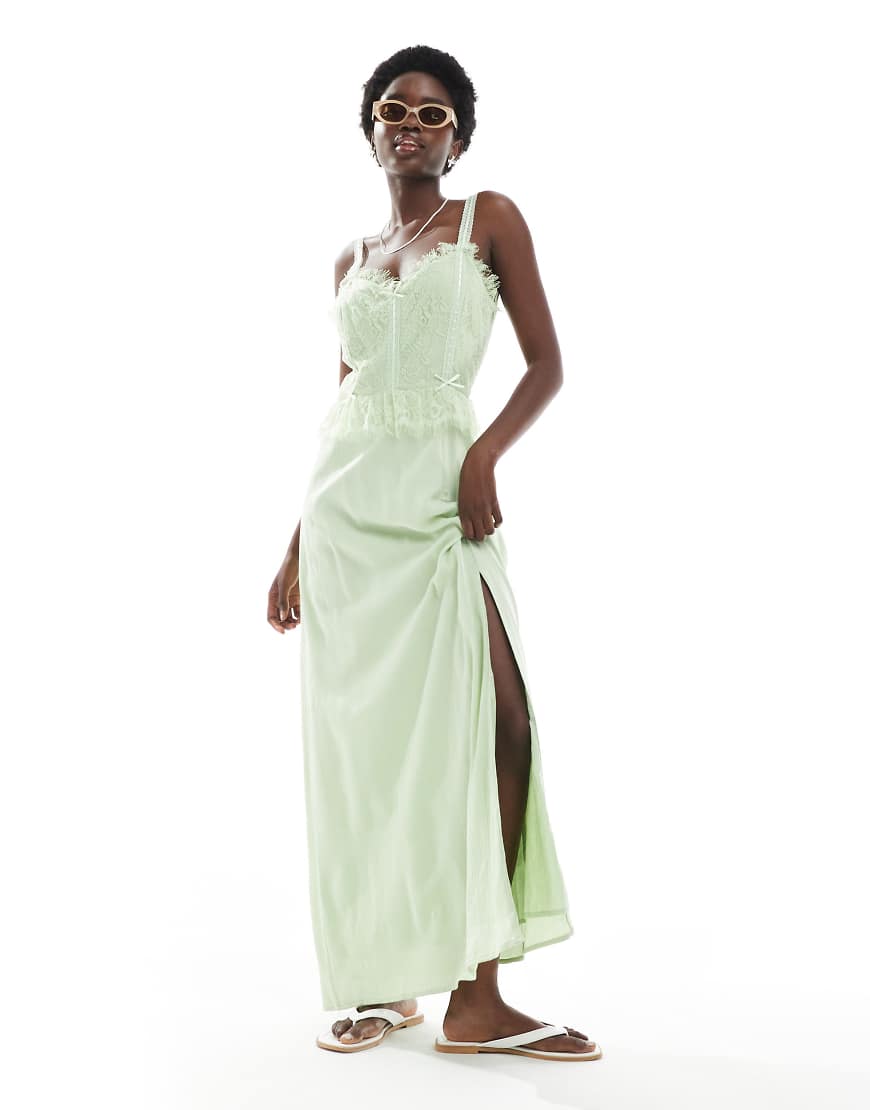 Miss Selfridge - Korsett-Maxikleid aus grob gewebter Baumwolle in Grün mit Schleifenbesatz Miss Selfridge - Korsett-Maxikleid aus grob gewebter Baumwolle in Grün mit Schleifenbesatz von Miss Selfridge