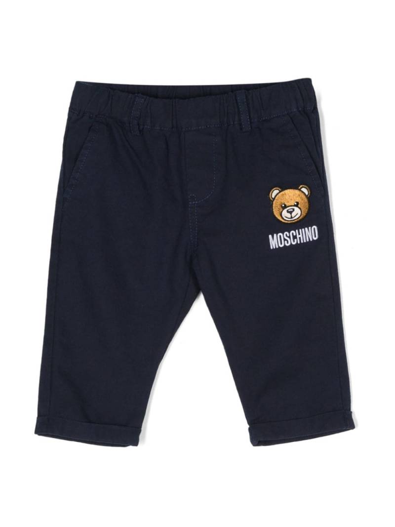 Moschino Kids Tapered-Hose mit Leo Teddy-Applikation - Blau von Moschino Kids