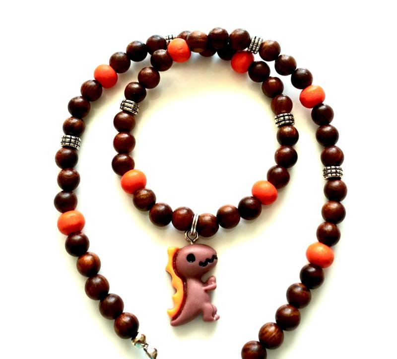 Kinder-Holzkette Mit Dino-Anhänger Kette Perlen Kinderkette Jungen Holzkette Kinderschmuck Geschenkidee Kinder-Holzkette Mit Dino-Anhänger Kette Perlen Kinderkette Jungen Holzkette Kinderschmuck Geschenkidee von MsSchmuck